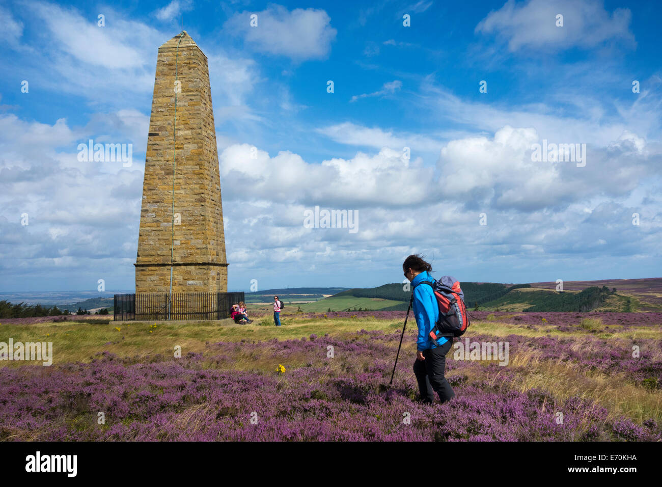 Female walker near Captain Cook`s monument on The Cleveland Way National Trail, North York Moors National Park, England, UK Stock Photo